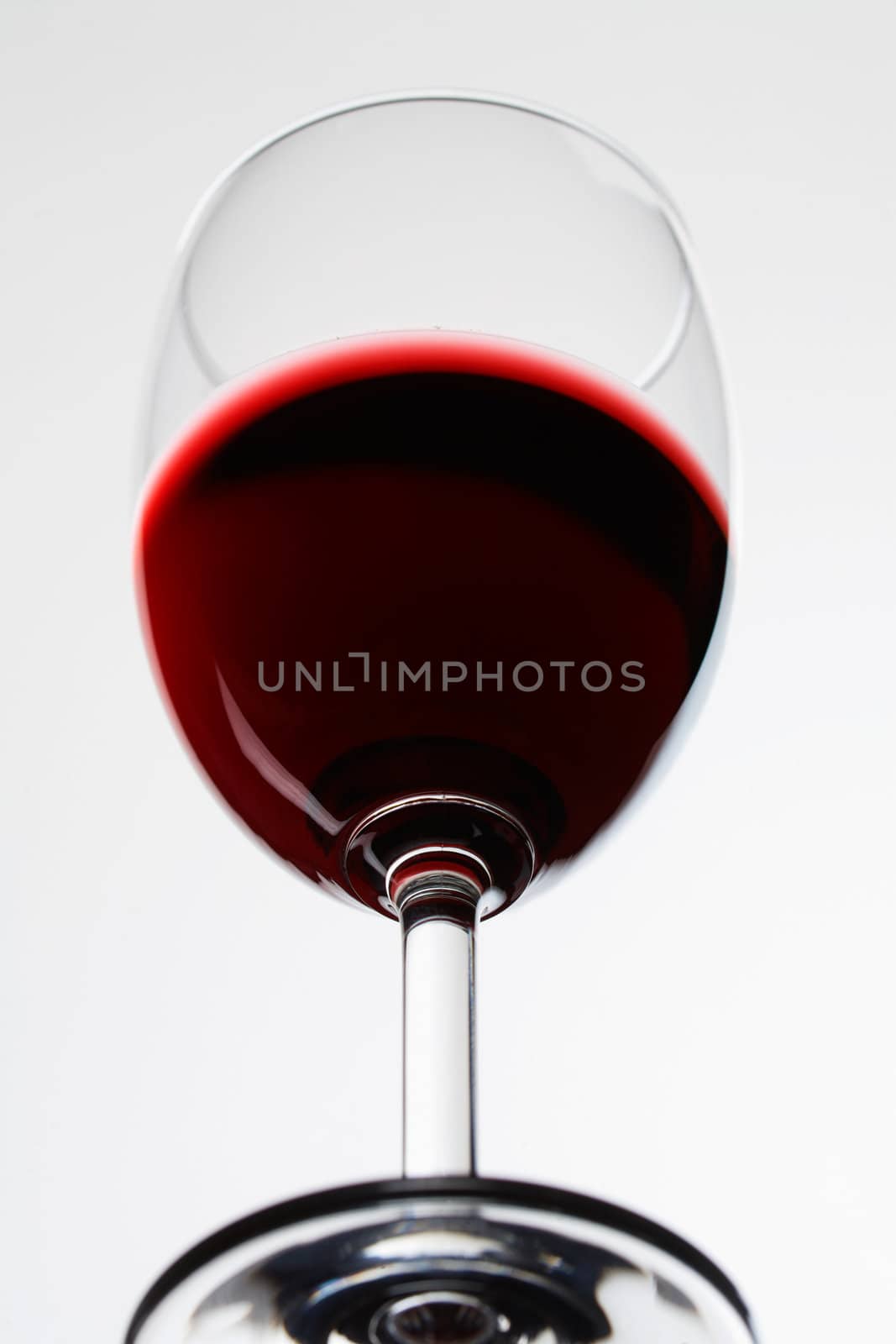 Glass with red wine isolated on white background 
