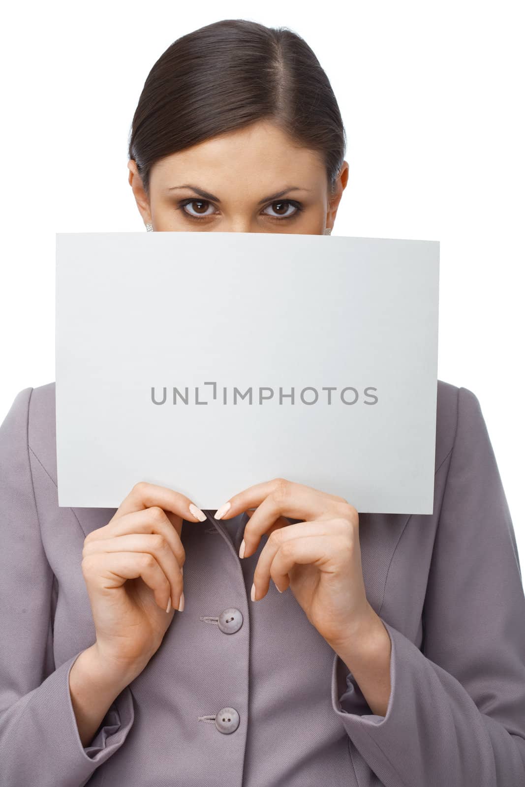 Closeup portrait of a young girl hiding behind an empty white billboard , isolated on white 