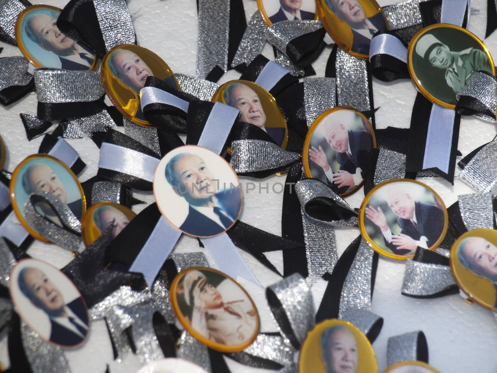 Phnom Penh - November 10 : former king of Cambodia  Norodom Sihanouk  badges on sale in front of the Royal Palace in Phnom Cambodia on November 10 2012  few weeks after his death