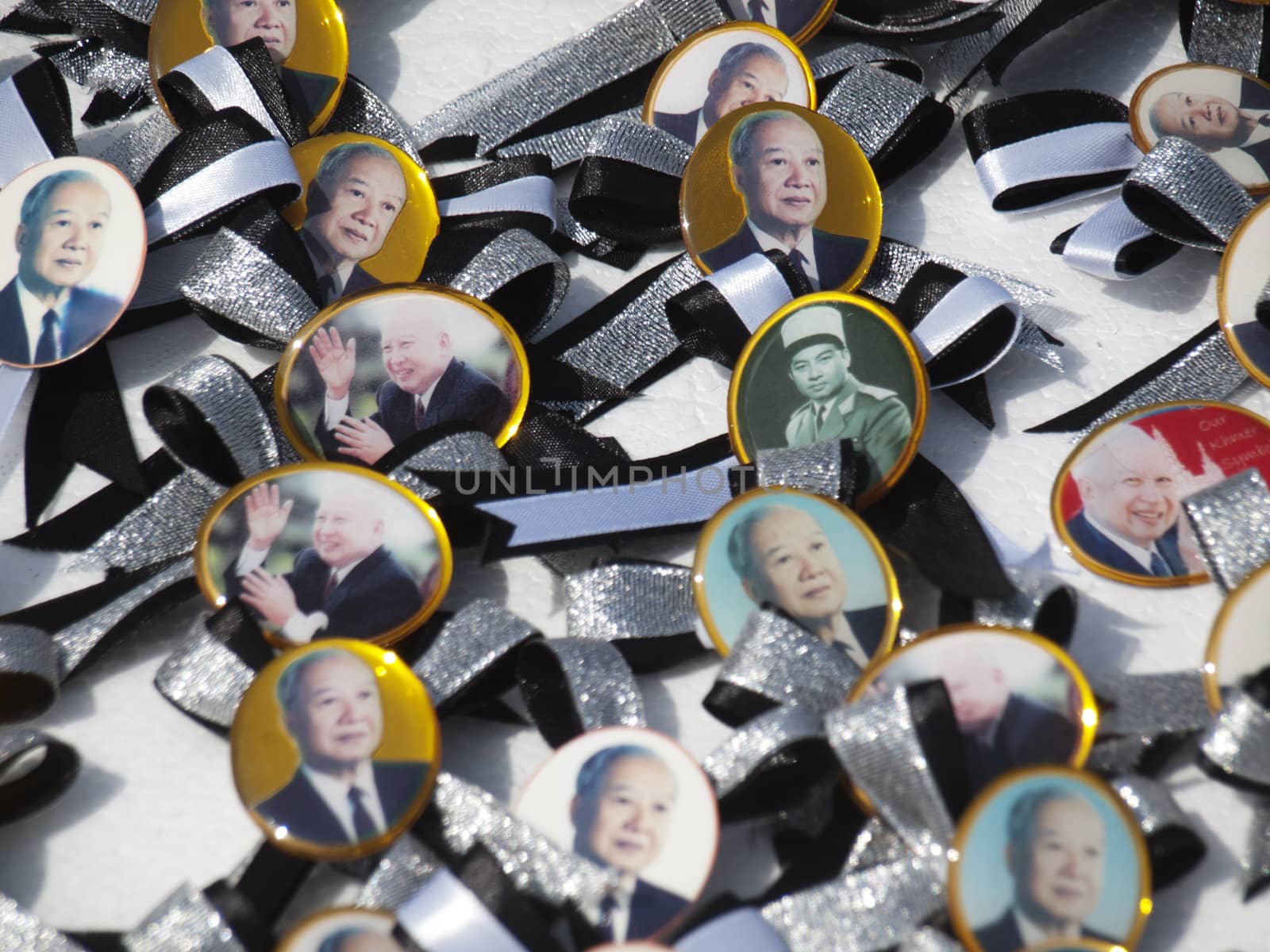 Phnom Penh - November 10 : former king of Cambodia  Norodom Sihanouk  badges on sale in front of the Royal Palace in Phnom Cambodia on November 10 2012  few weeks after his death