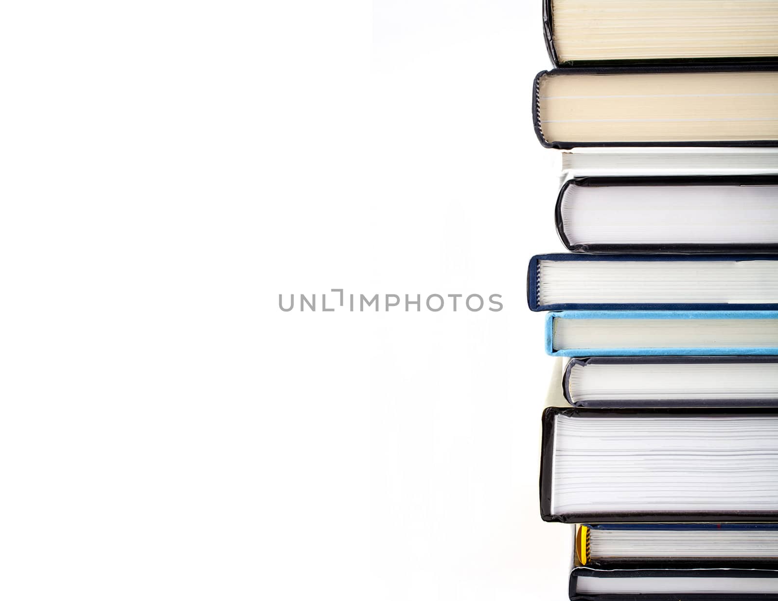 Abstract shot of a pile of Books over a white background.
