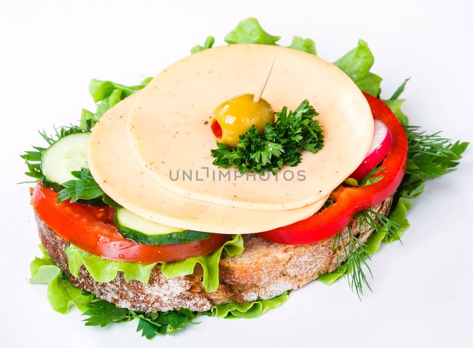 sandwich with ham,cheese and vegetables on white background