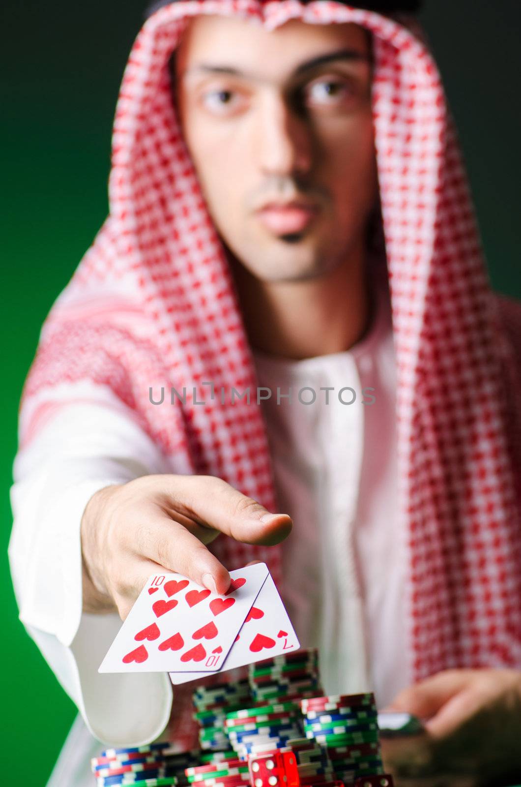 Arab playing in casino - gambling concept with man