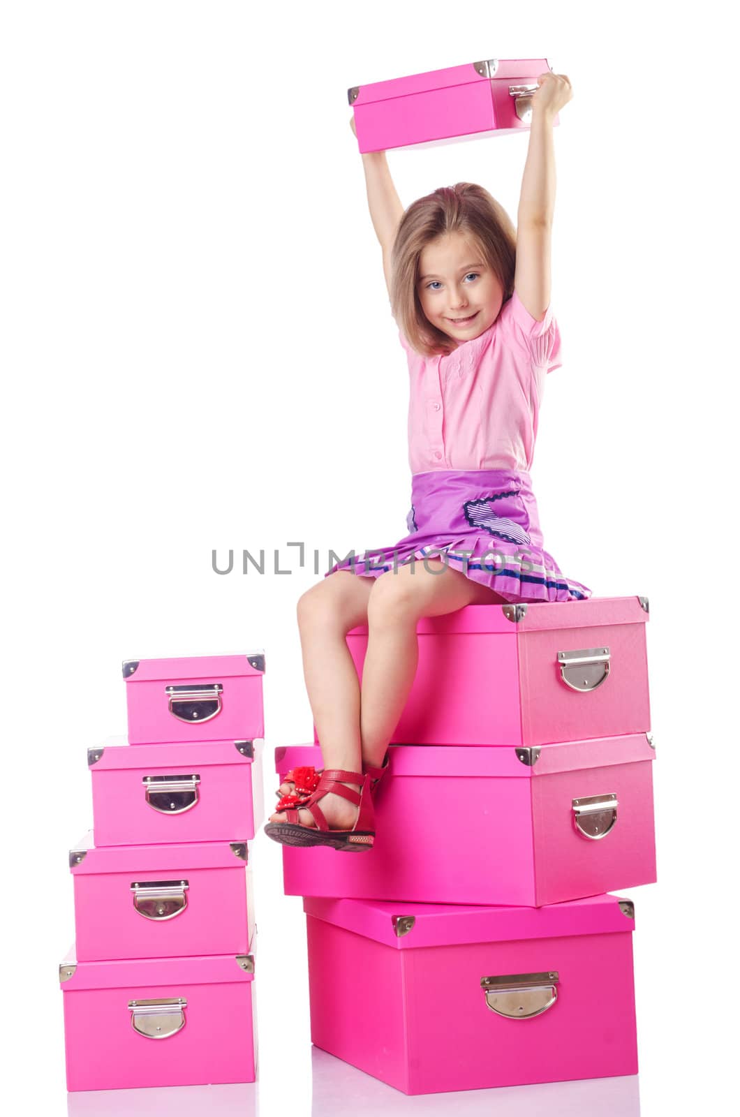 Little cute girl with lots of boxes
