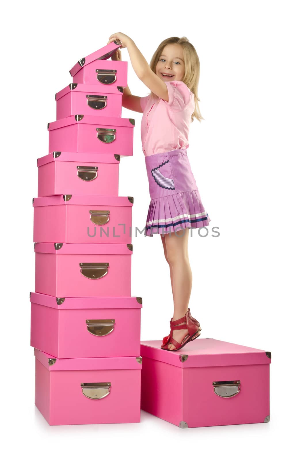 Little cute girl with lots of boxes