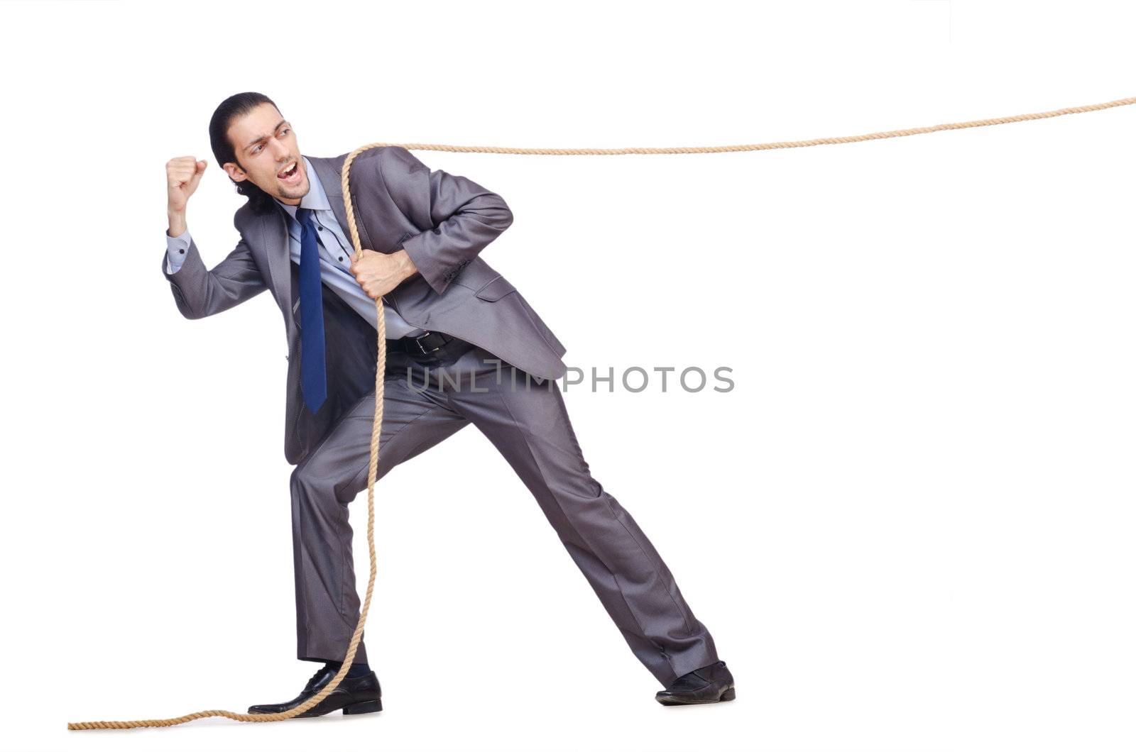 Businessman pulling rope on white