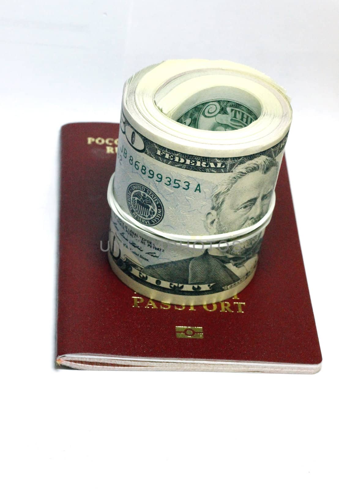 Stack of paper usa dollars inside the red passport