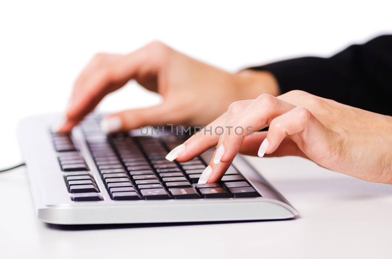 Hands working on the keyboard
