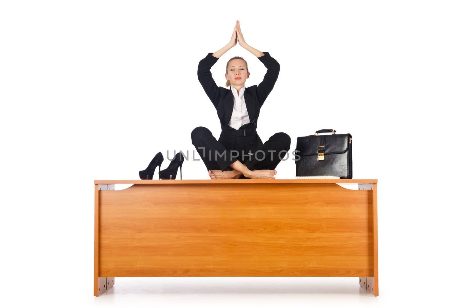 Businesswoman meditating isolated on white