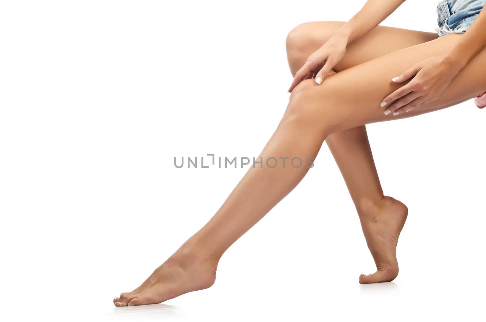 Long woman legs isolated on white