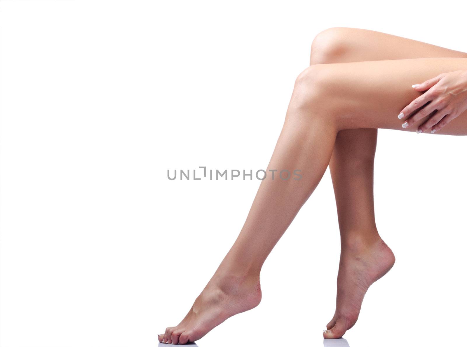 Long woman legs isolated on white