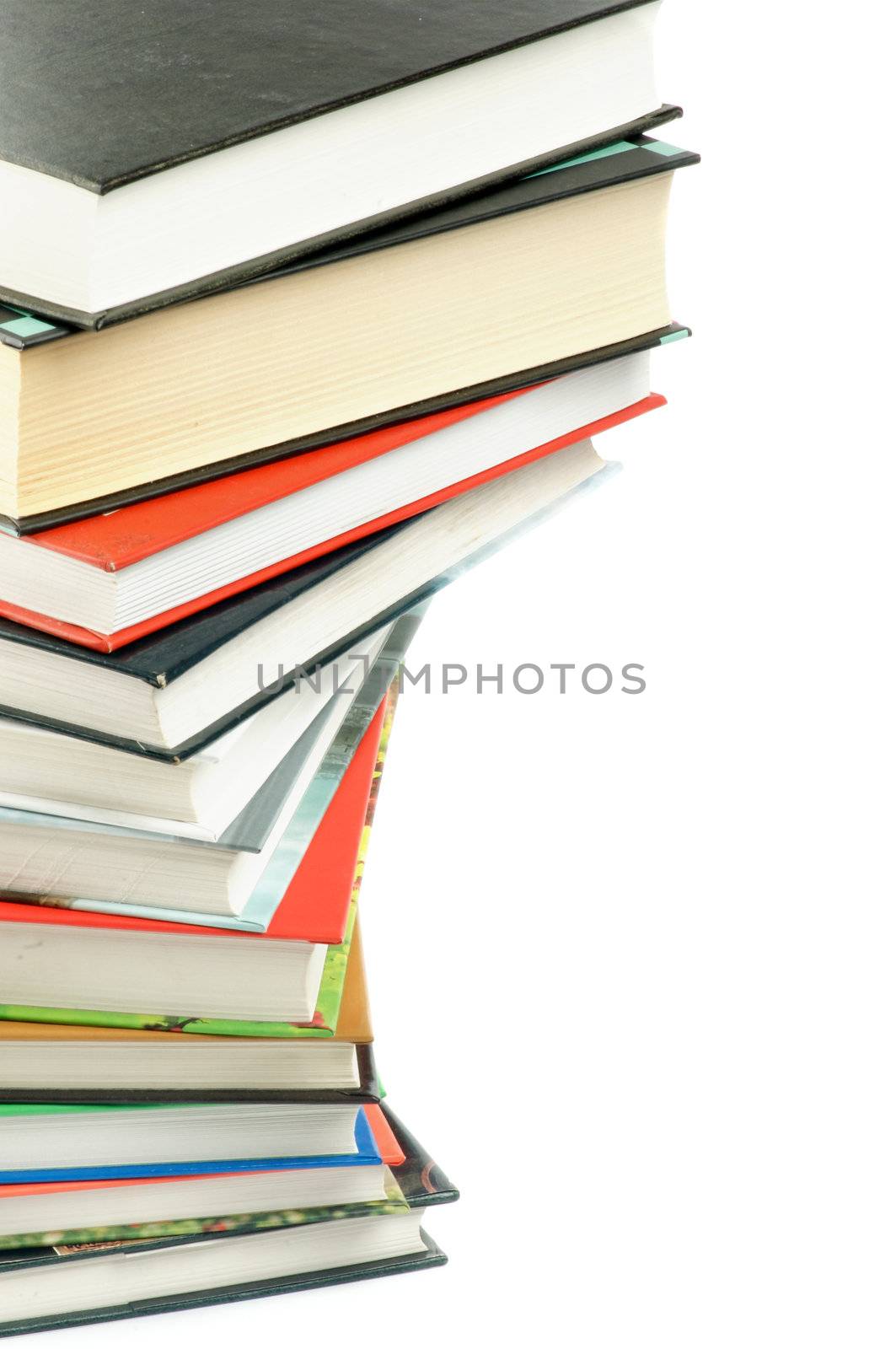 Stack of Multi-Colored Books as Frame closeup on white background