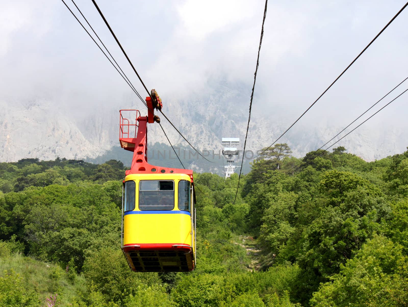 aerial ropeway cabin going from mountain