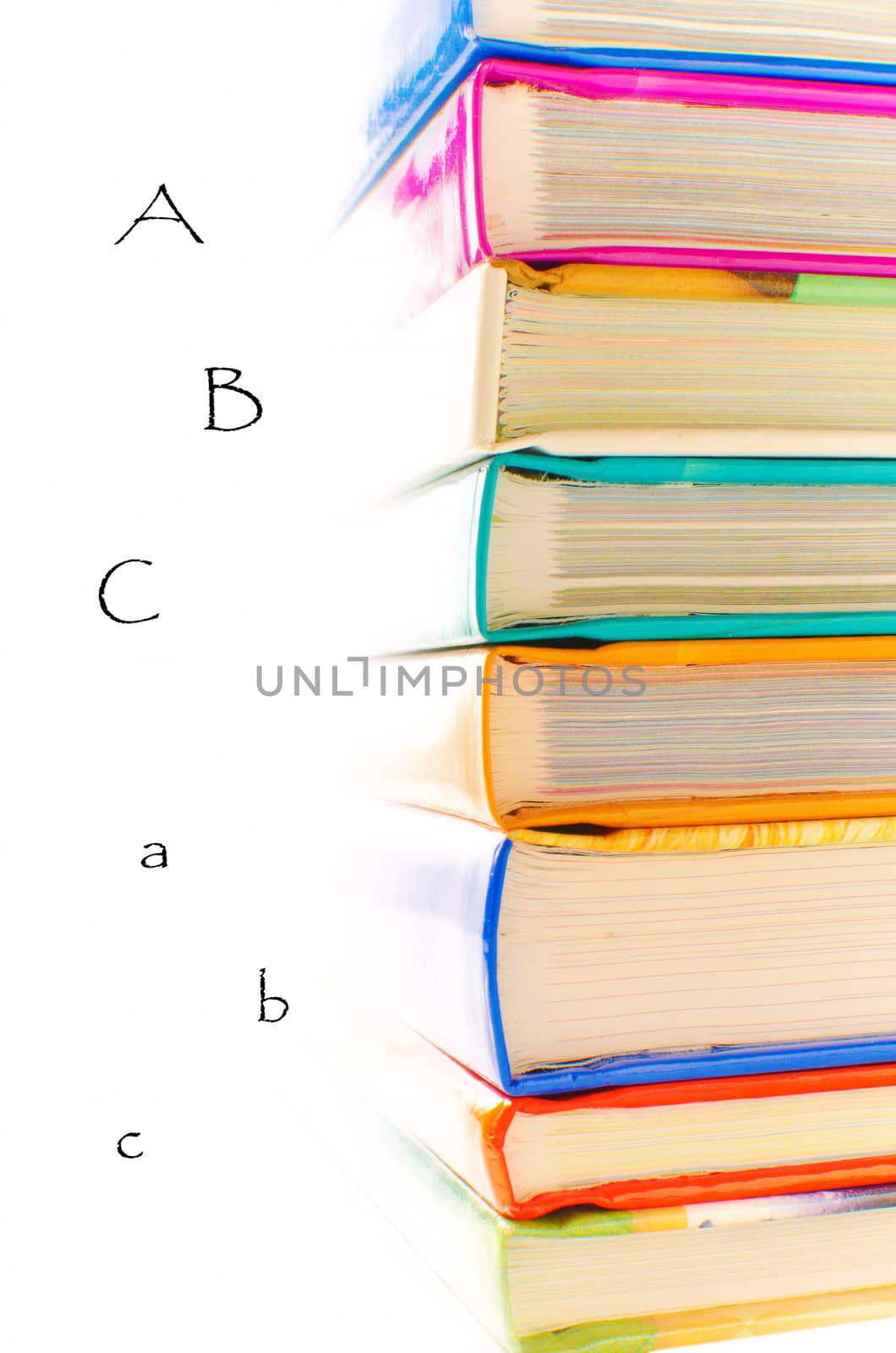 Stack of books on white background with letters