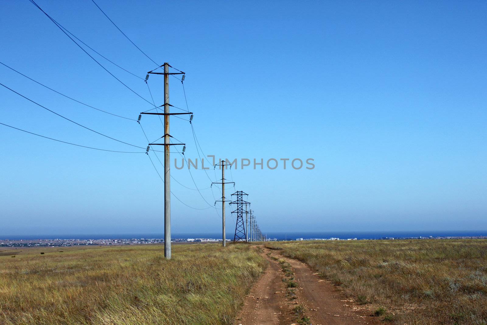 row of electricity pillons at countryside