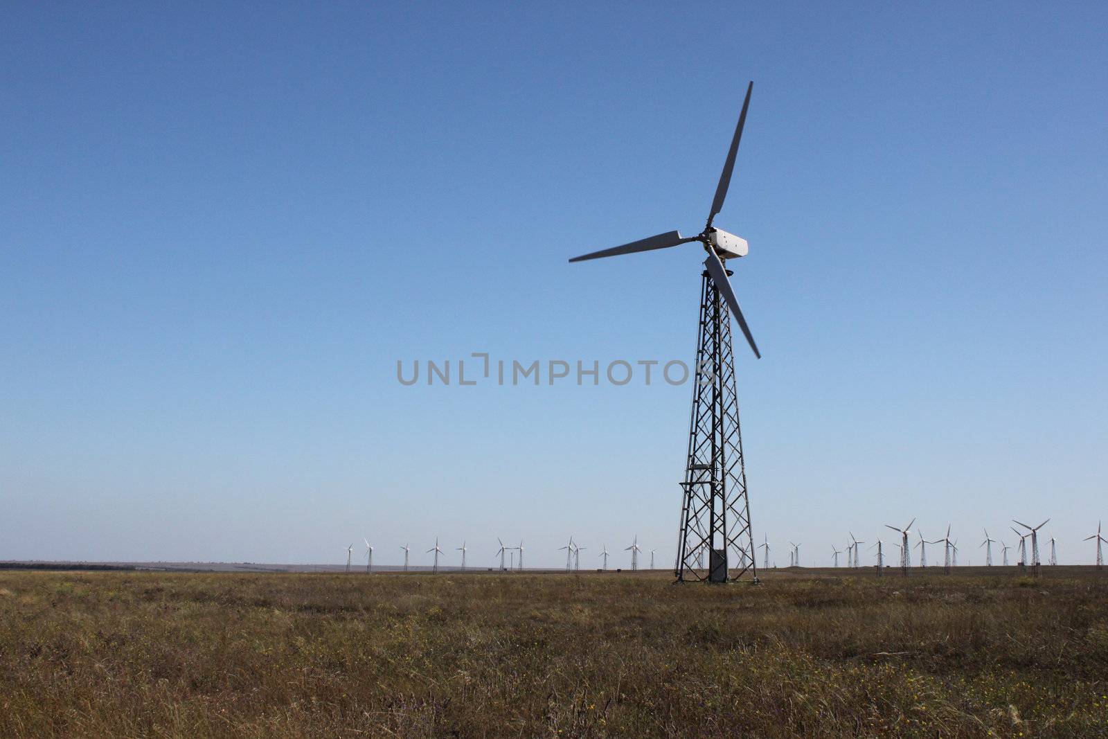 wind turbine over blue sky