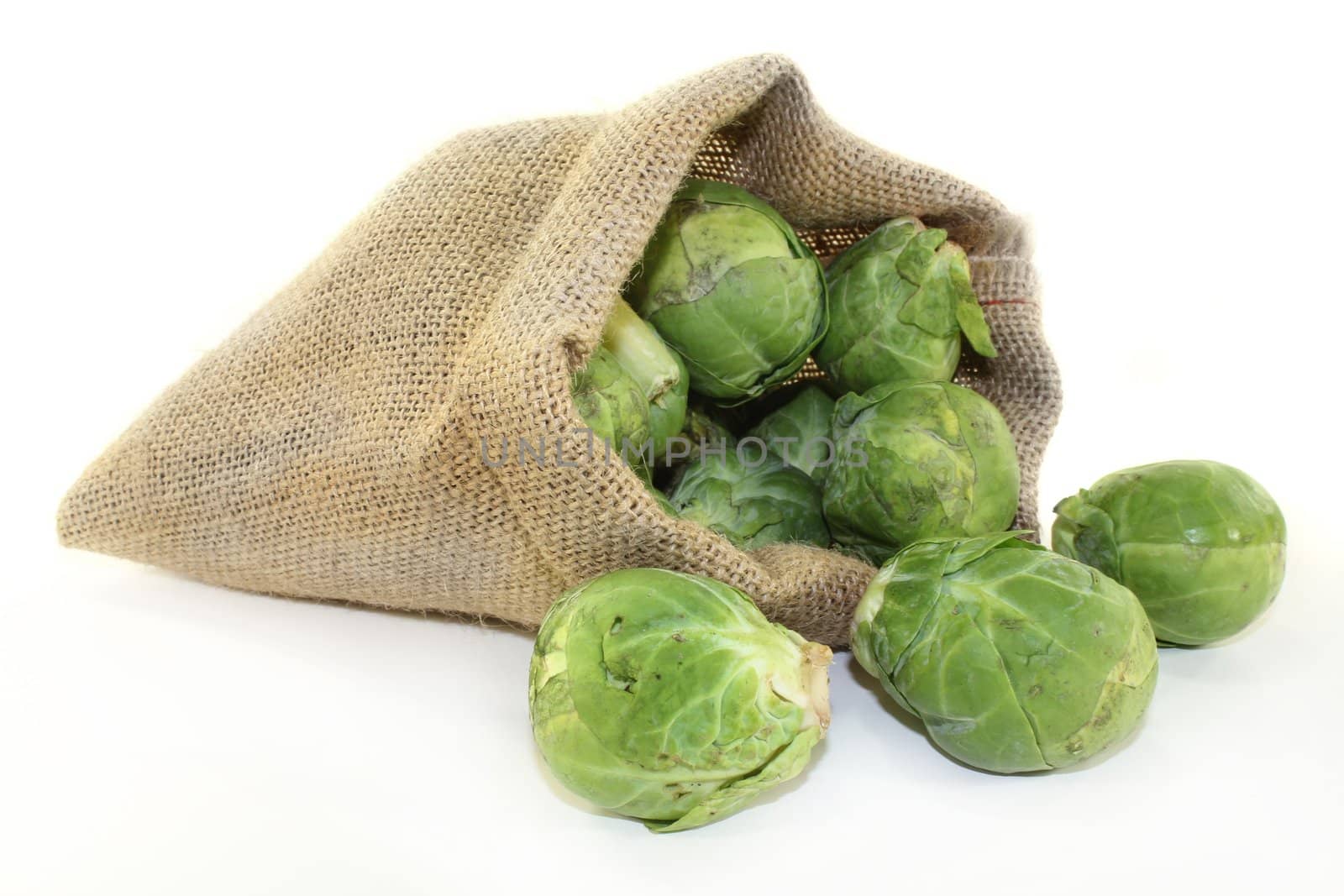 raw brussels sprouts in a jute sack