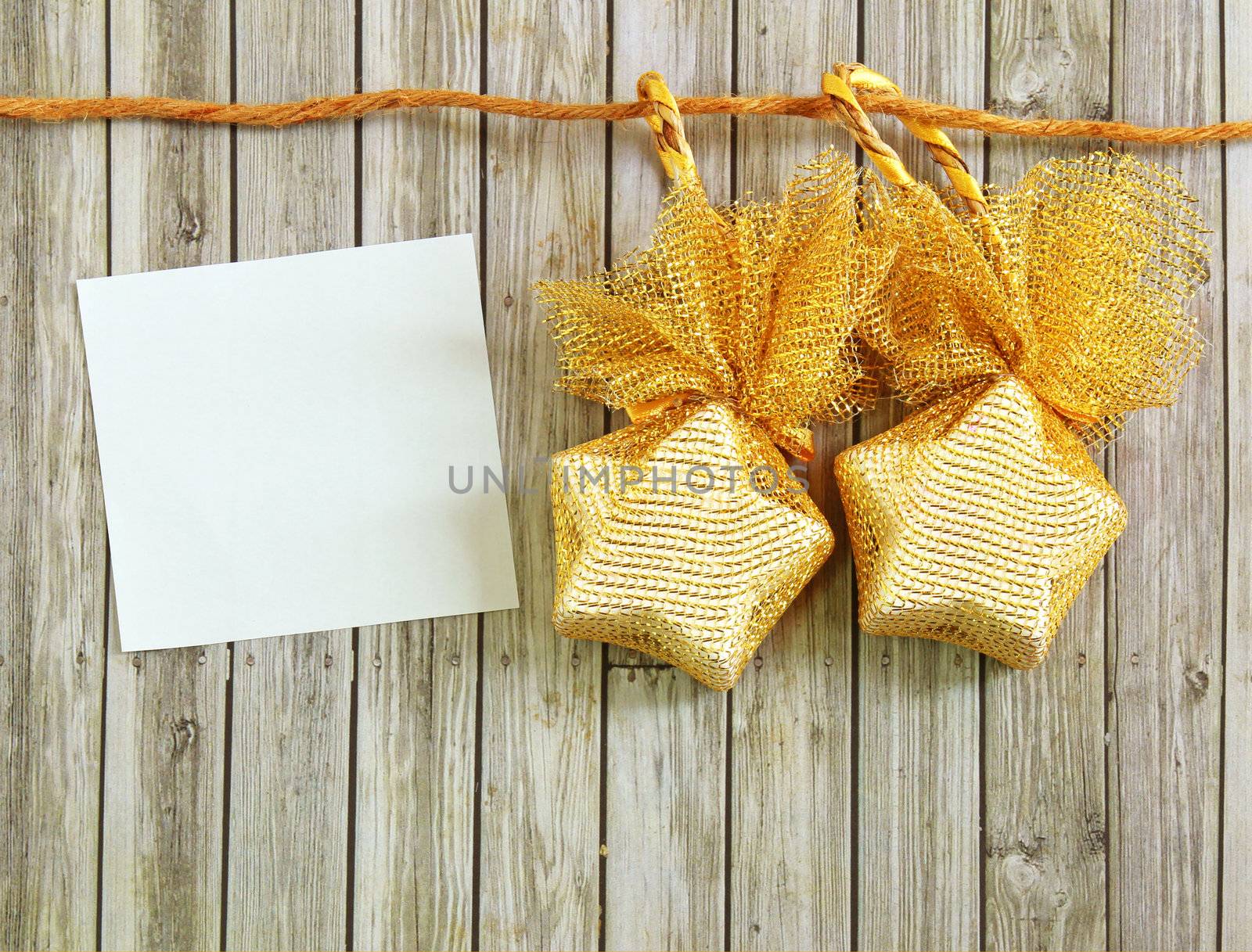 Christmas decoration with blank notebook over wooden background 