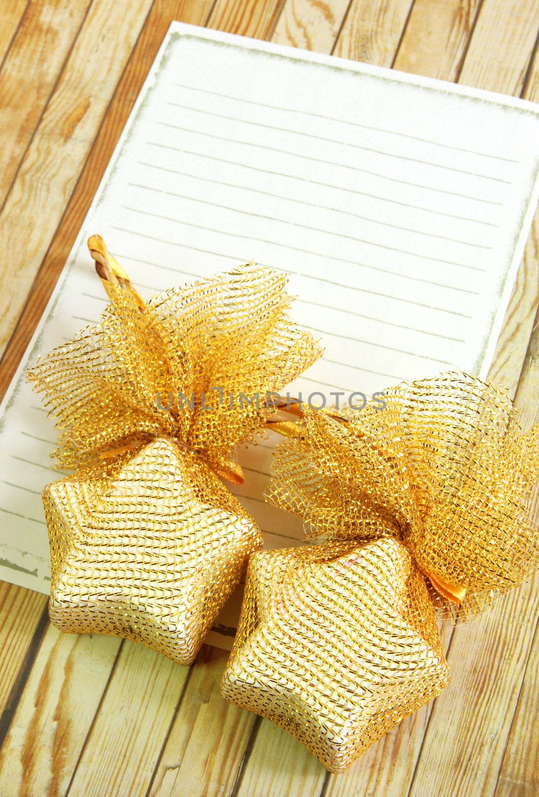 Christmas decoration with blank notebook over wooden background 