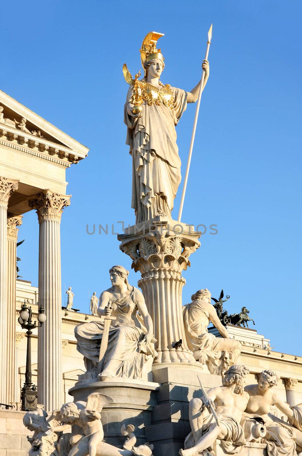 The Austrian Parliament and Athena Fountain in Vienna, Austria by vladacanon