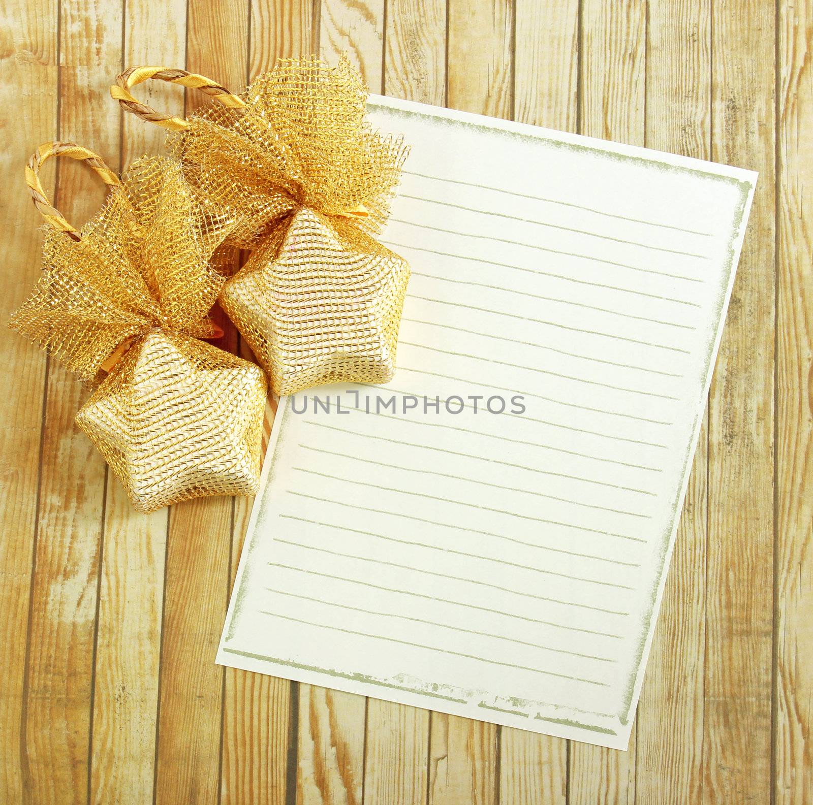 Christmas decoration with blank notebook over wooden background  by nuchylee