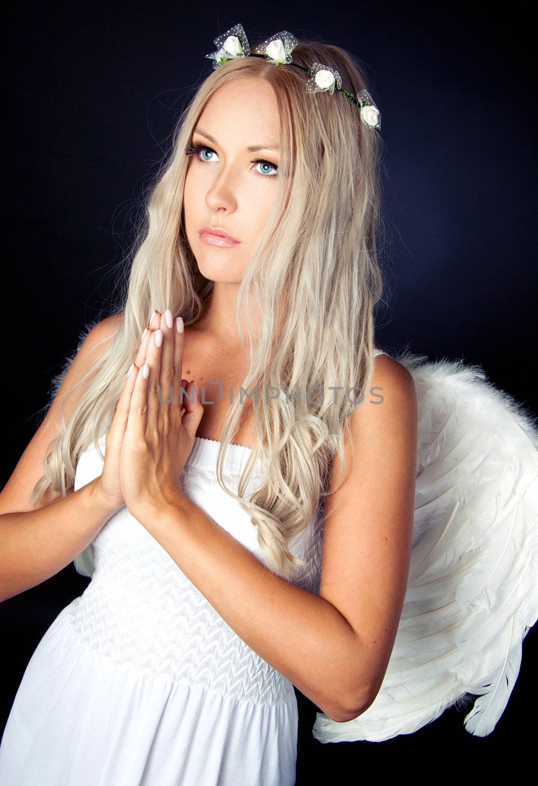 Portrait of a blonde in white Angel costume 