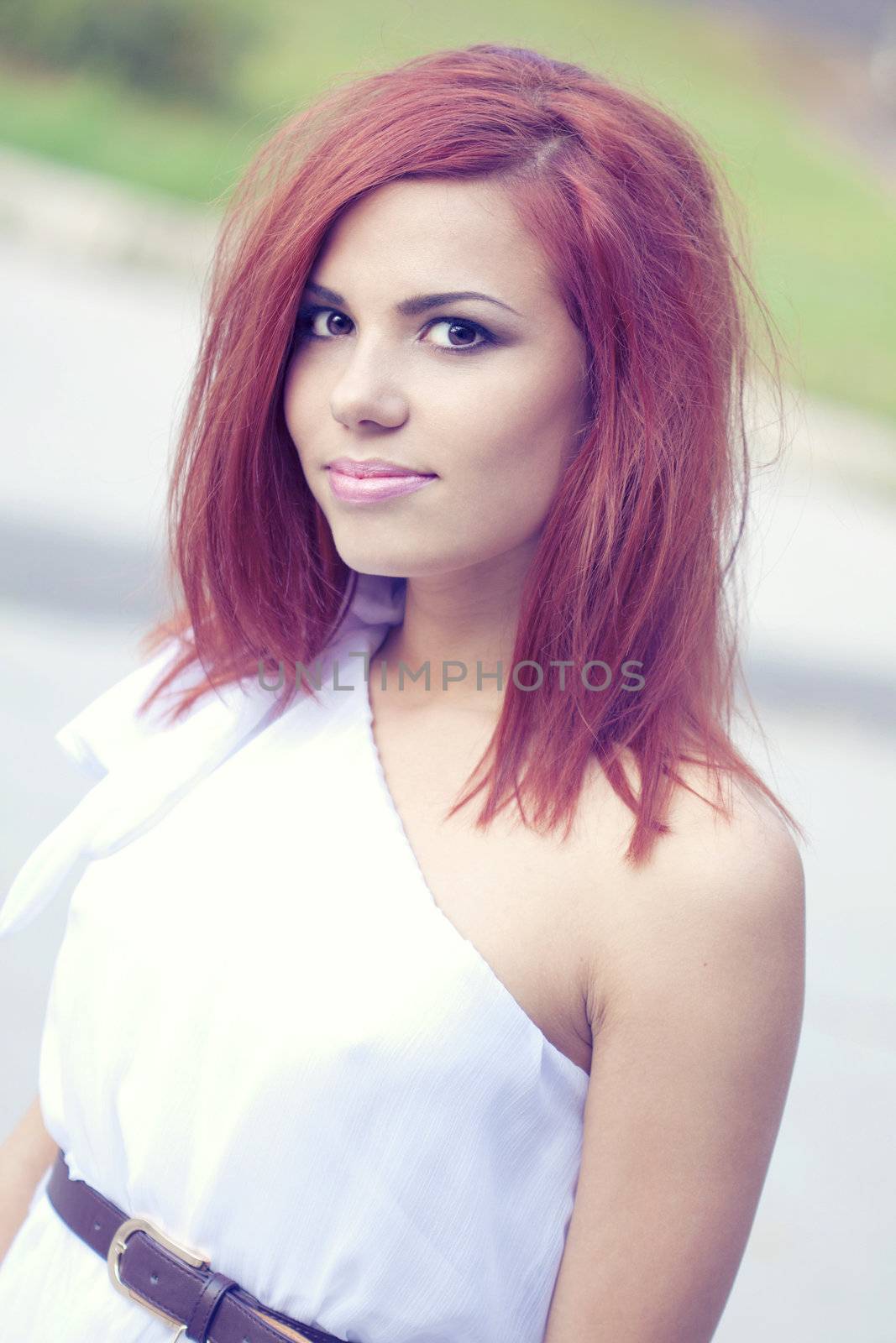 Red Hair girl smilling at the camera