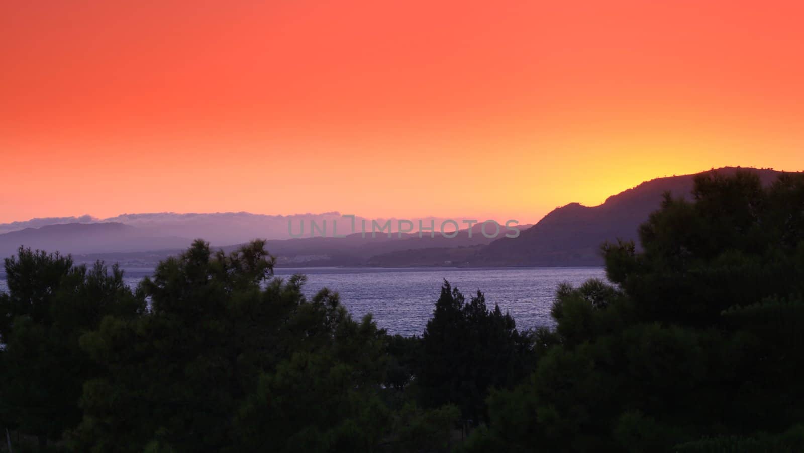 Sunset at Pefkos beach Rhodes Island in Greece