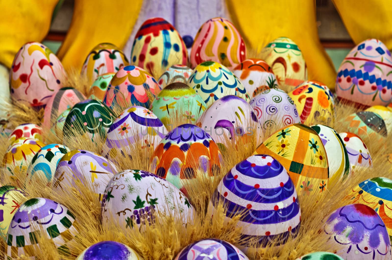 A basket filled with large Easter eggs.