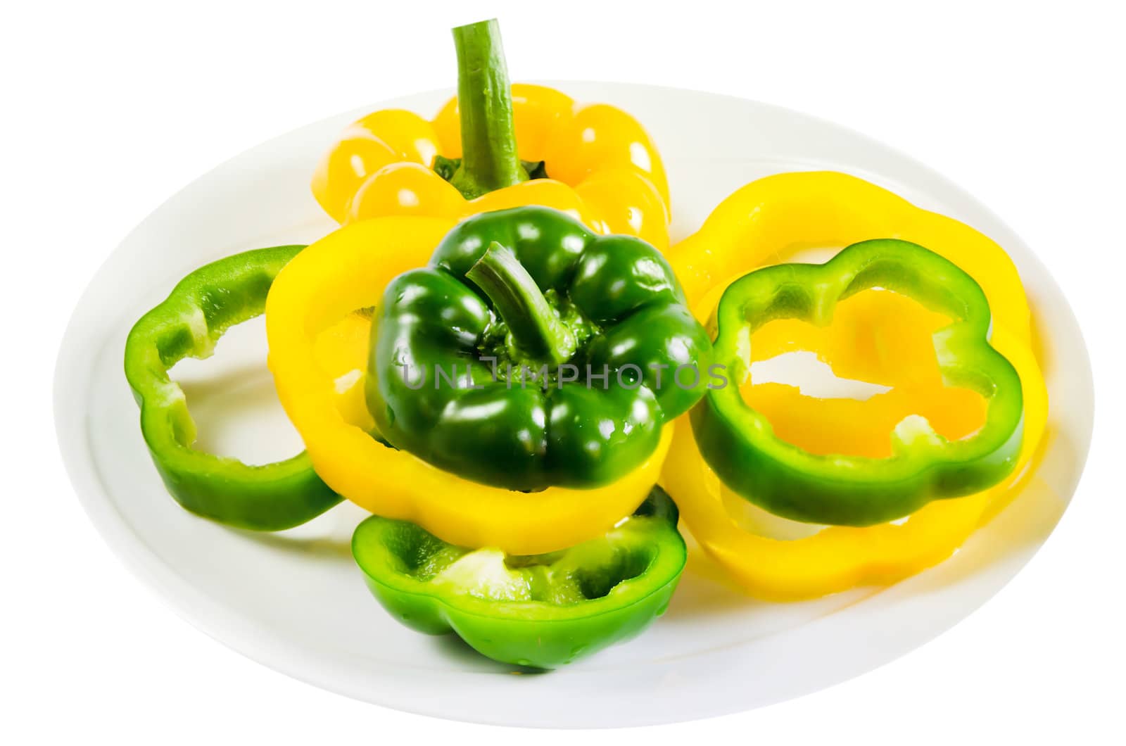 slice of green  sweet  pepper and yellow sweet pepper on white plate