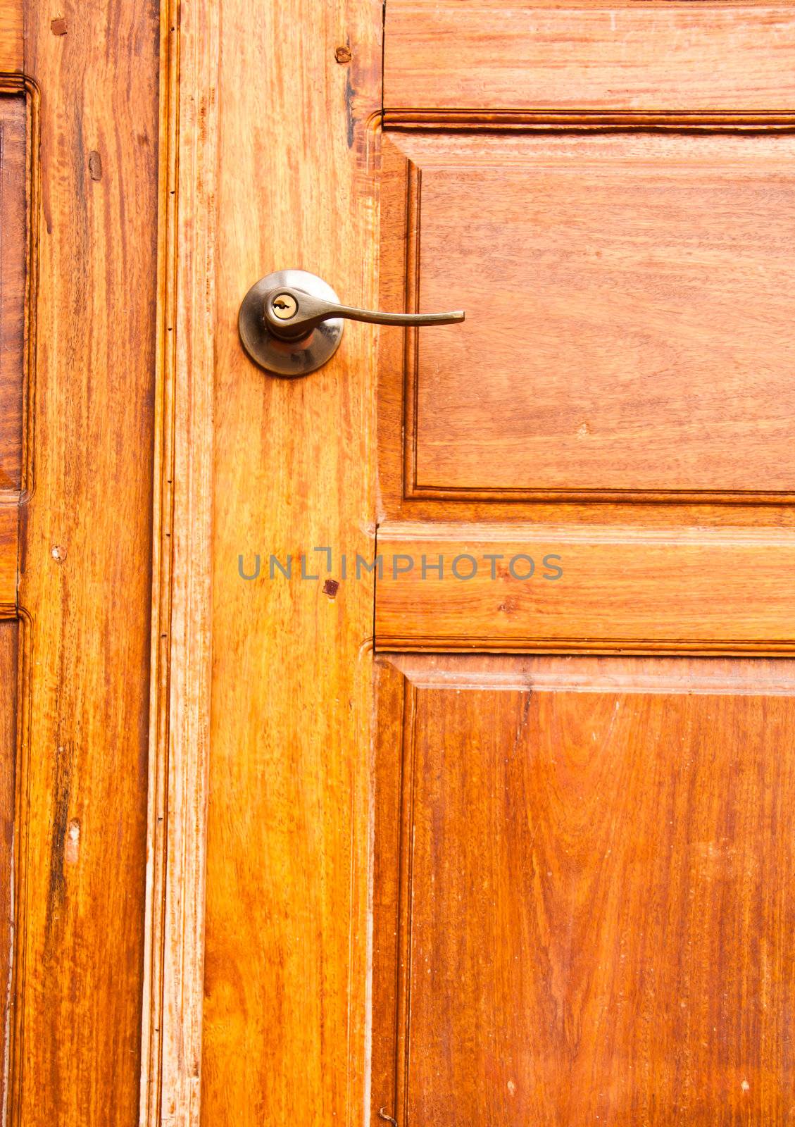 Wooden door with a knob.