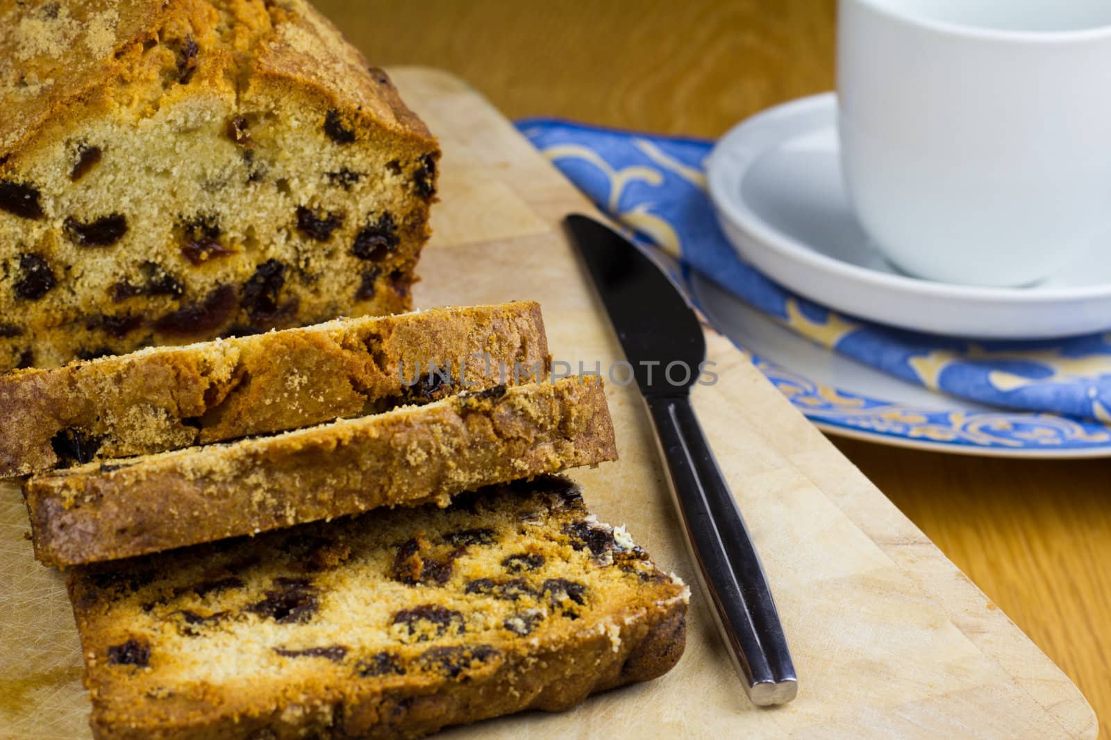 Slices of rich fruit loaf cake for tea