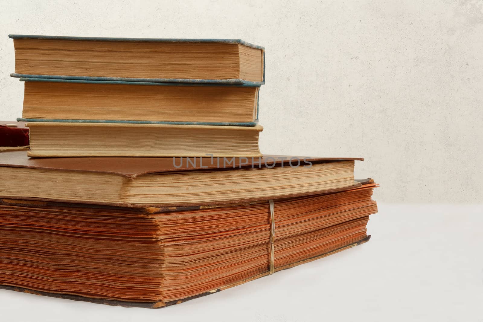 collection of old worn books on white