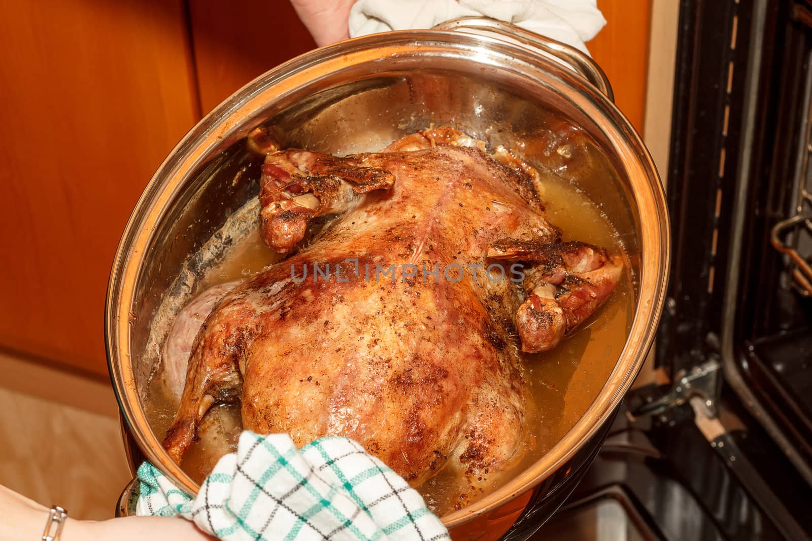 photo of roast duck in the oven in home