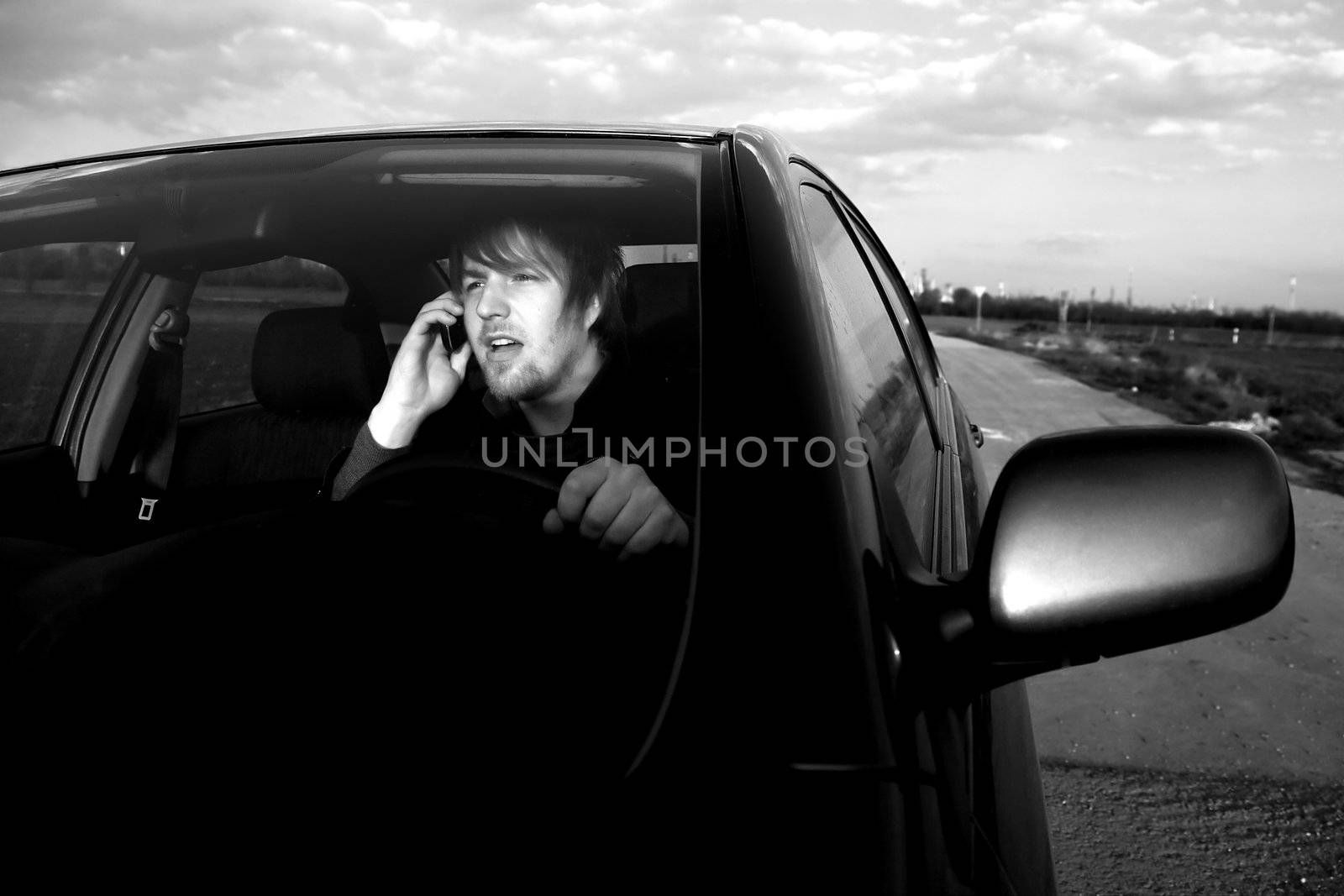 Man calling on the phone while driving