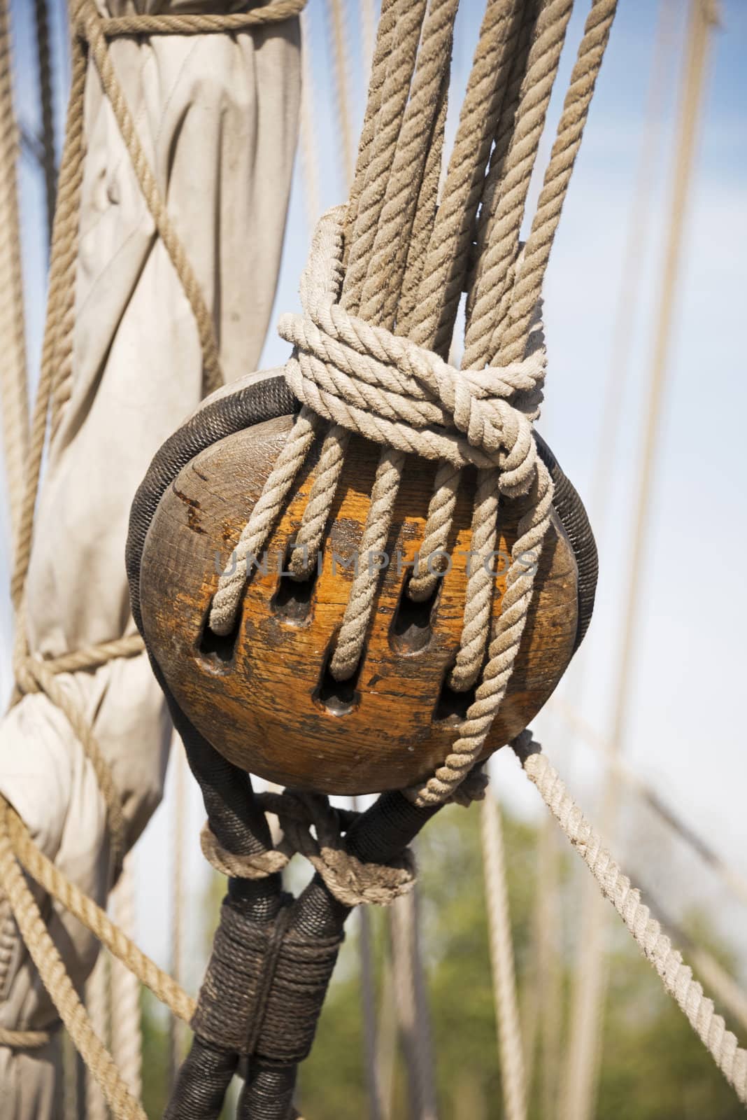 wooden pulley with rope on a ship