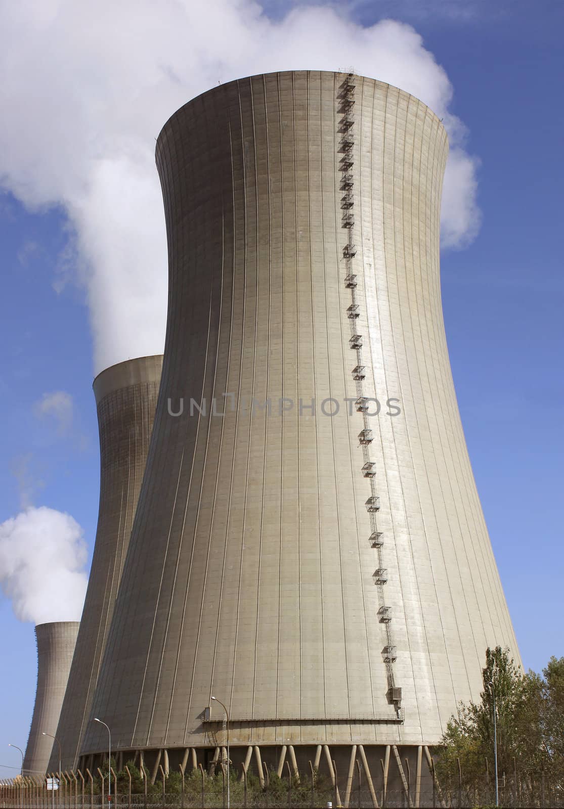 photo of a nuclear power plant chimneys active