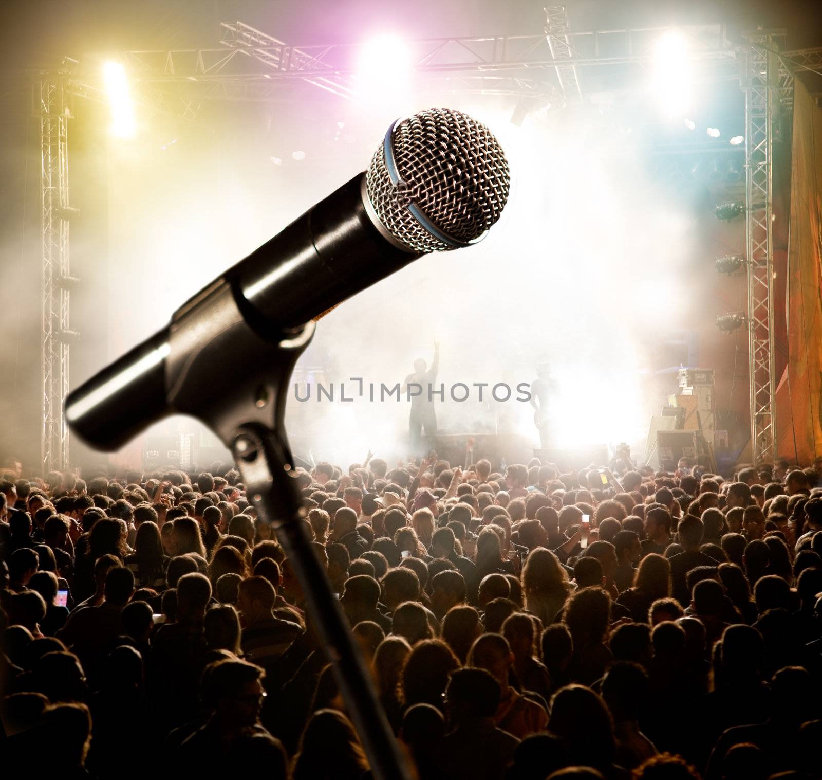 Live music background.Microphone and public