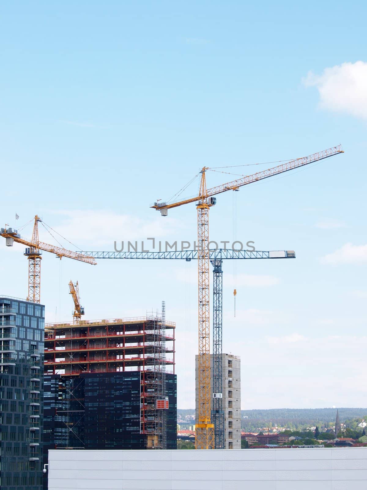 Construction site overview in a city, towards blue sky