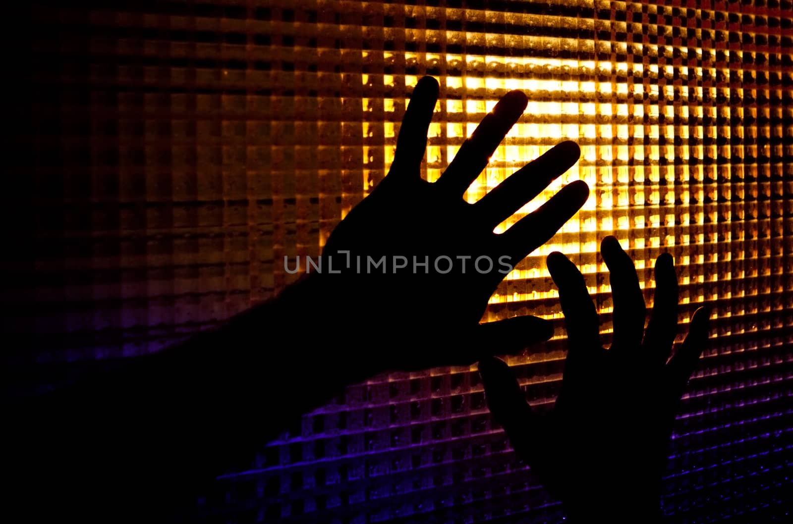 Abstract image of backlit silhouettes of hands