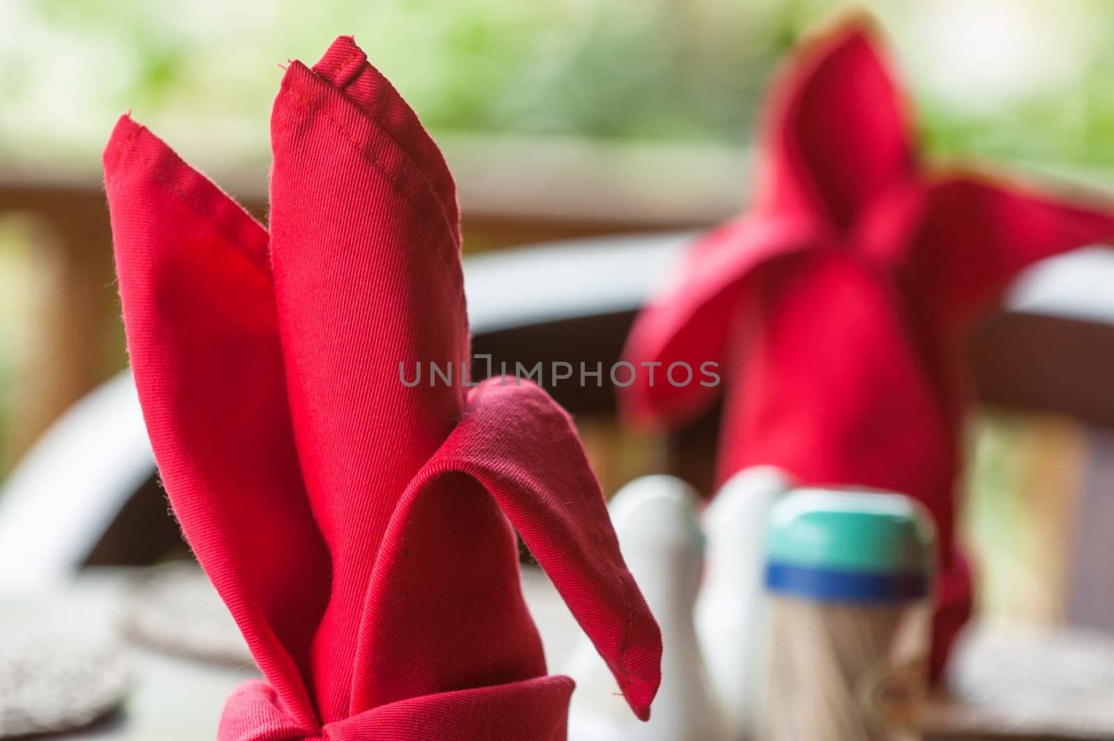 Folded napkins outdoors on a table in the tropics