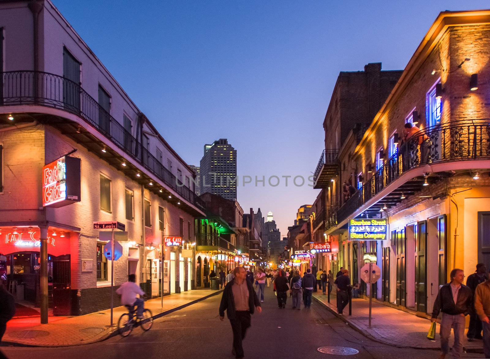 NEW ORLEANS, USA - CIRCA MARCH 2008: Crowds of people and neon lights at dusk circa March 2008 in New Orleans, USA. Tourism is the area's major source of income after Hurricane Katrina in 2005.