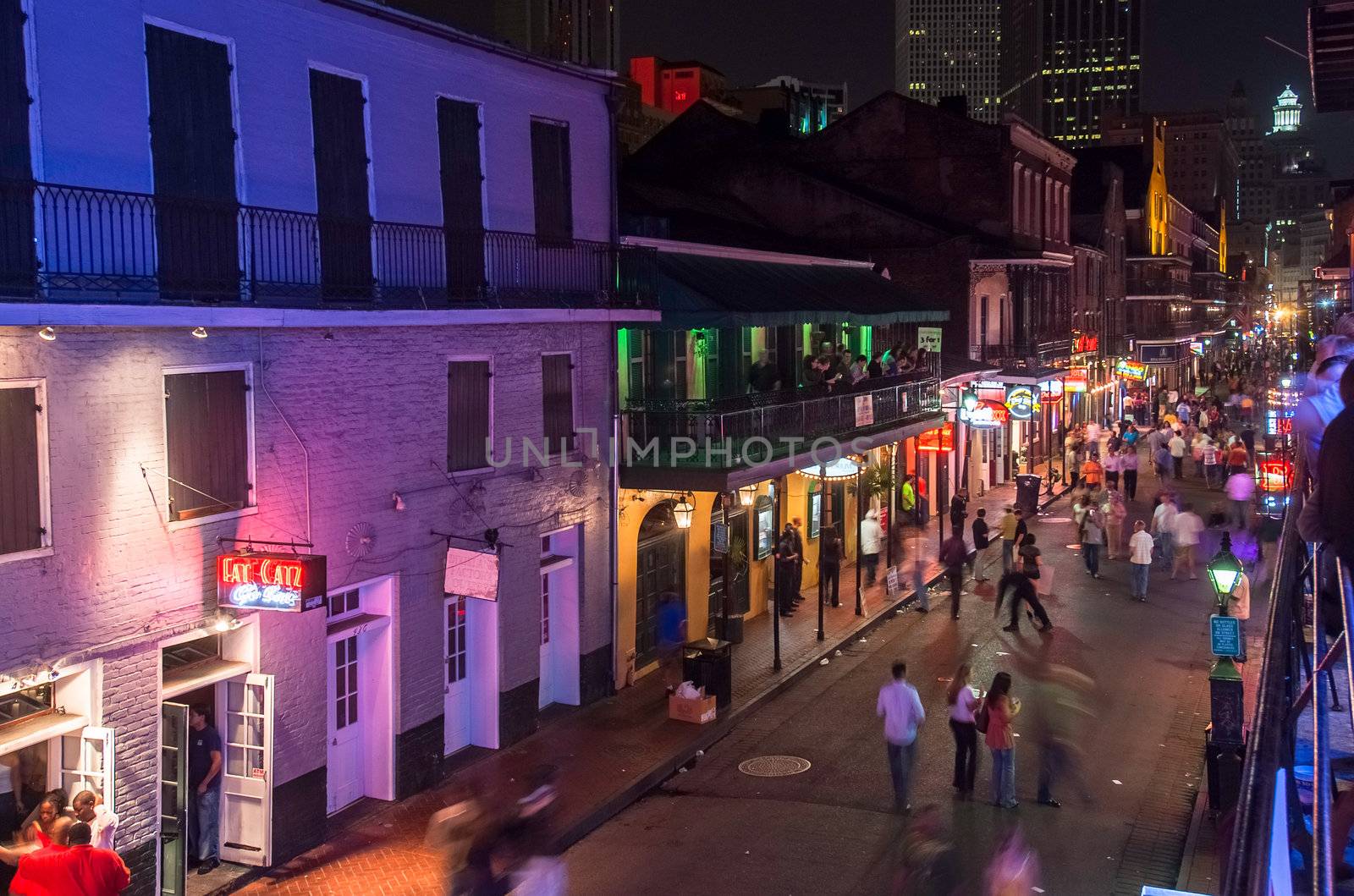 NEW ORLEANS, USA - CIRCA MARCH 2008: Crowds of people and neon lights at dusk circa March 2008 in New Orleans, USA. Tourism is the area's major source of income after Hurricane Katrina in 2005.