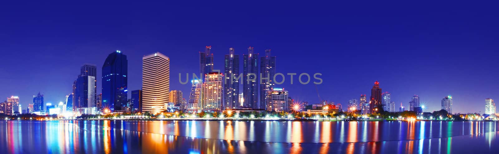 A beautiful city at night. Light reflected on the water body.