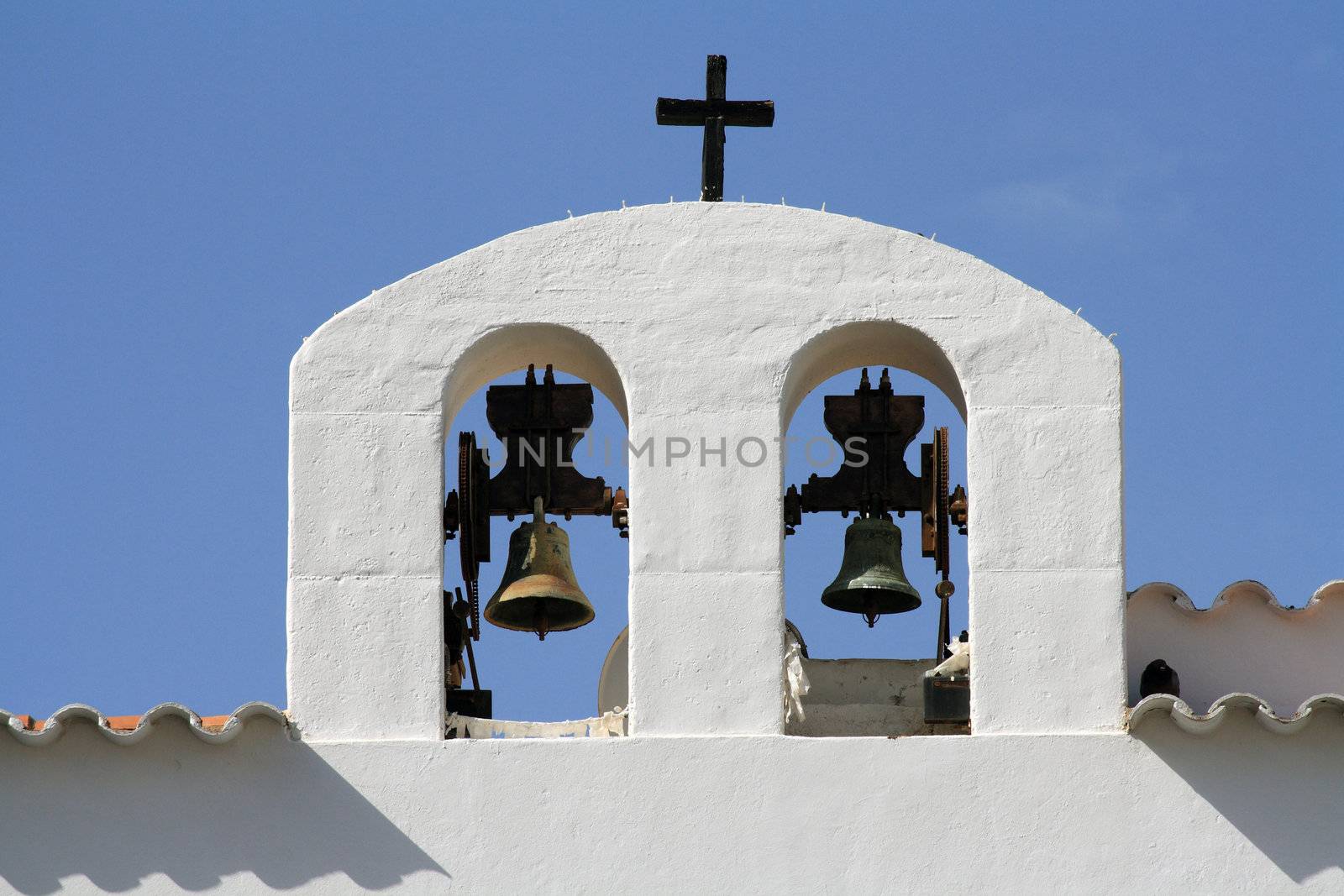 Two bells of a white church in Ibiza