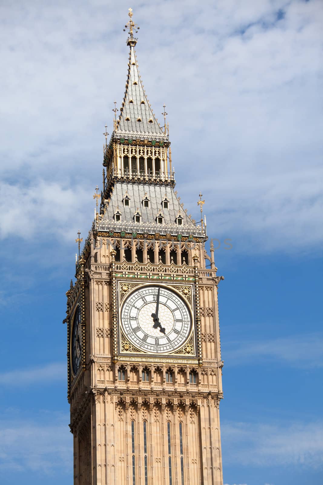 Britain national symbol Clock Big Ben (Elizabeth tower in Gothic Revival style) at 5 o’clock on cloudy sky background in London