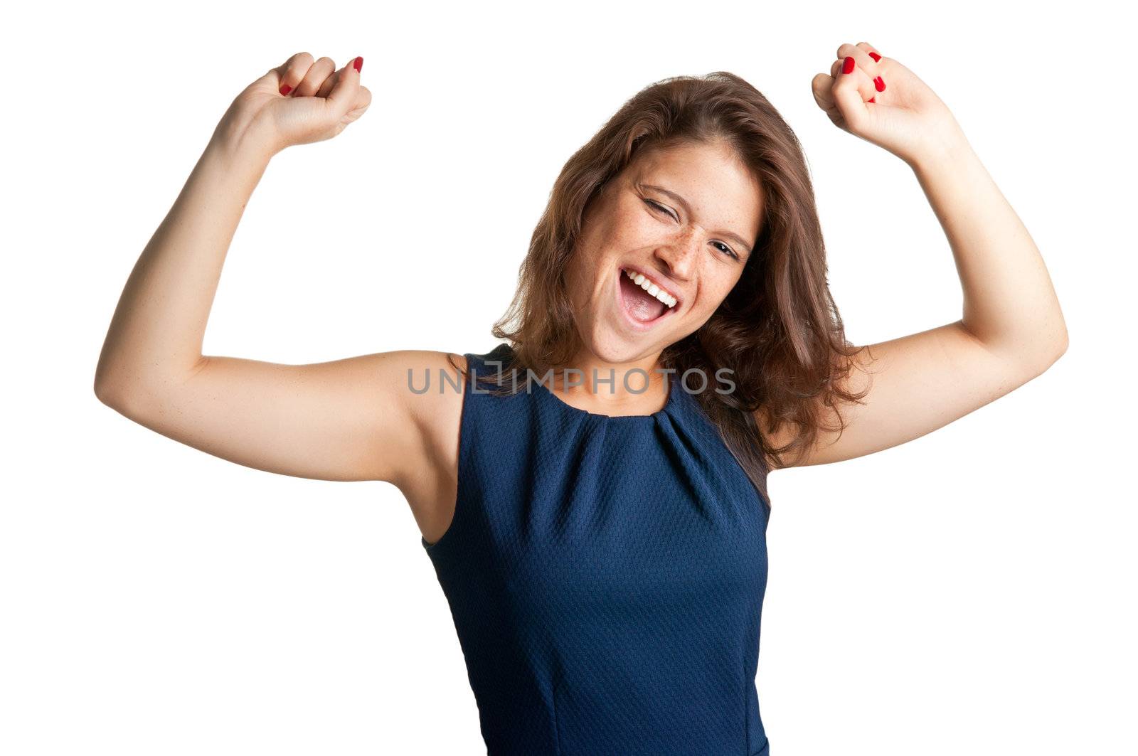 Young brunette smiling with her arms up in the air, isolated in a white background