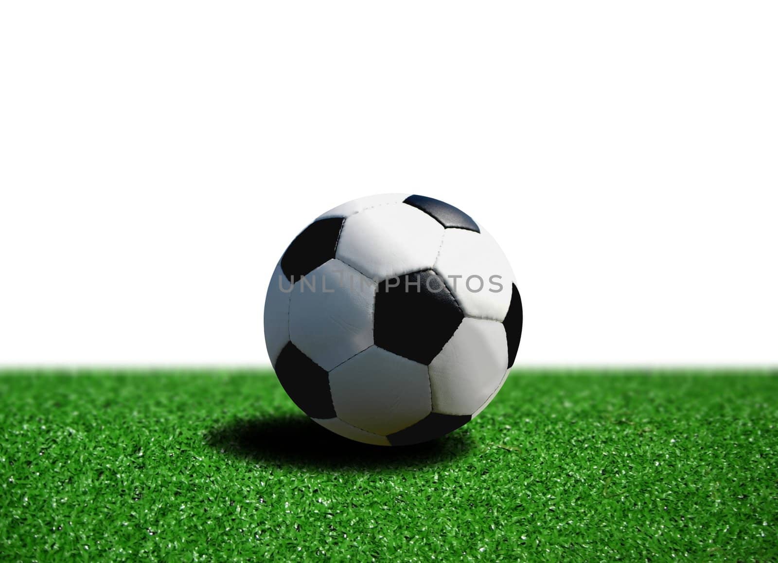 ball on grass over white