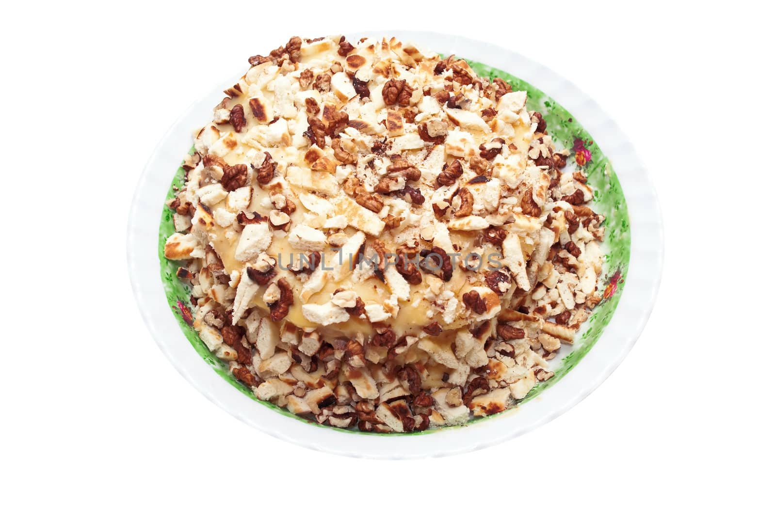 Sweet cake covered with walnut isolated on white background.