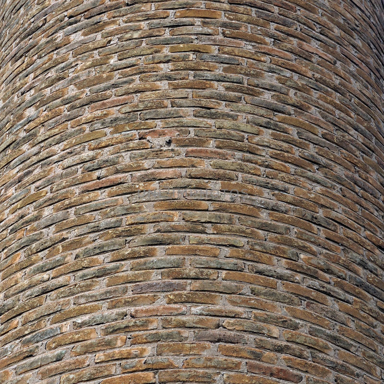 Curved brick wall background texture. Factory chimney detail.